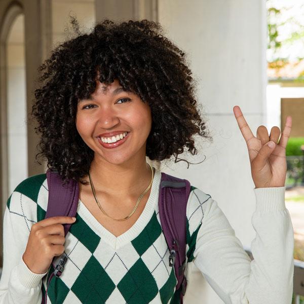 student giving the hook'em